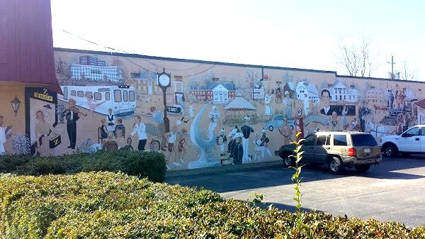 Picture of history of Cary, NC portrayed in a mural near La Farm Bakery 