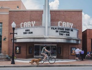 Front view of Cary Theater with man on bike