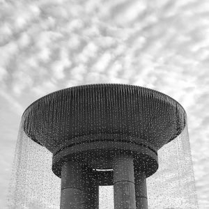 Black and white picture of top of park fountain 